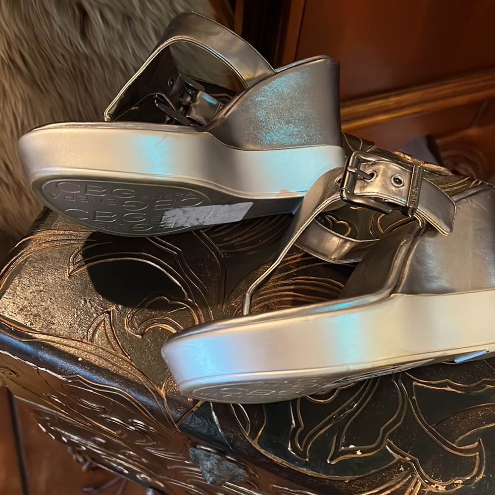 This BCBGeneration Wedge is Silver with a Pewter color combination. 6.5 M - Picture 5 of 7